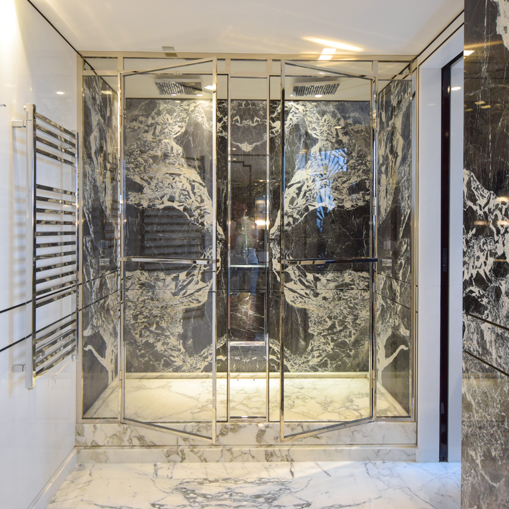Polished nickel shower screen with a frame
